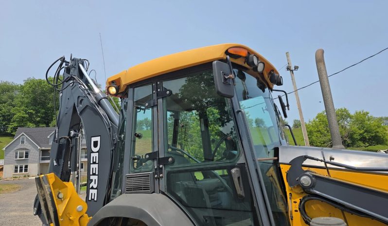 
								2011 DEERE 410J full									