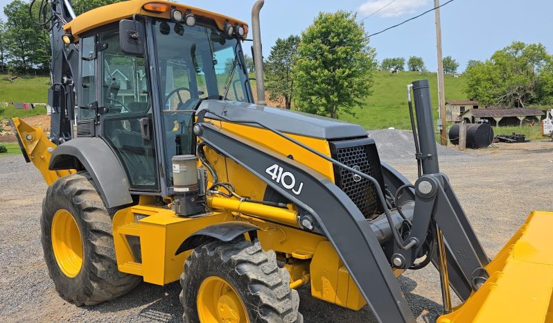 
								2011 DEERE 410J full									